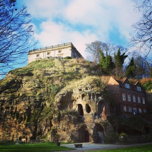The Caves of Castle Rock Nottingham. The entrance to Mortimer's Hole where Edward III's men entered the castle through a tunnel through the sandstone to capture Roger Mortimer and claim the throne in full for Edward III in 1330. The 17th century Ducal Palace now site on top of the sandstone cliff.